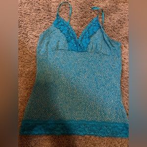 Stunning blue cami with lace trimming. Size S